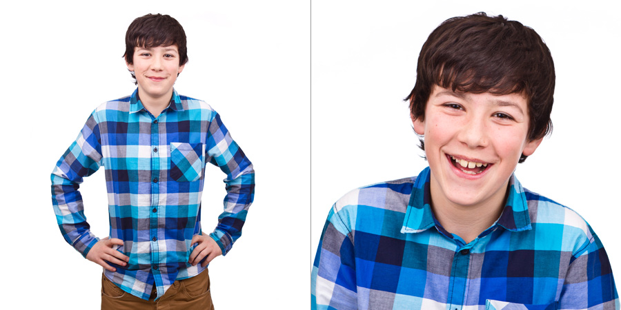 Smiling teen boy against white background