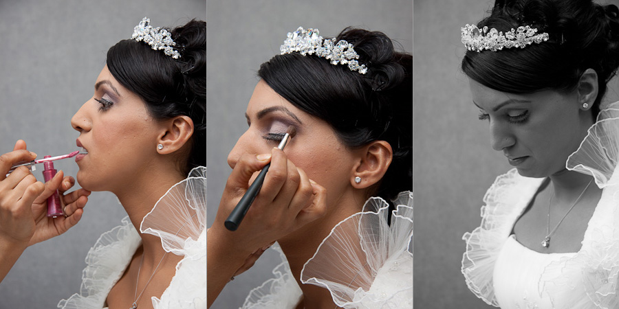 Final wedding preparations as the beautiful bride has her lip-gloss and eyeliner applied, ready for her wedding in Blackburn